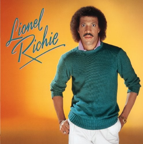 Album cover with a person wearing a green sweater on an orange background, featuring the name 'Lionel Richie'.